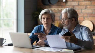 couple discussing over computer screen