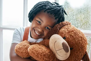 child with teddybear