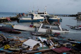 Damage to boats and flooding after hurricane Beryl