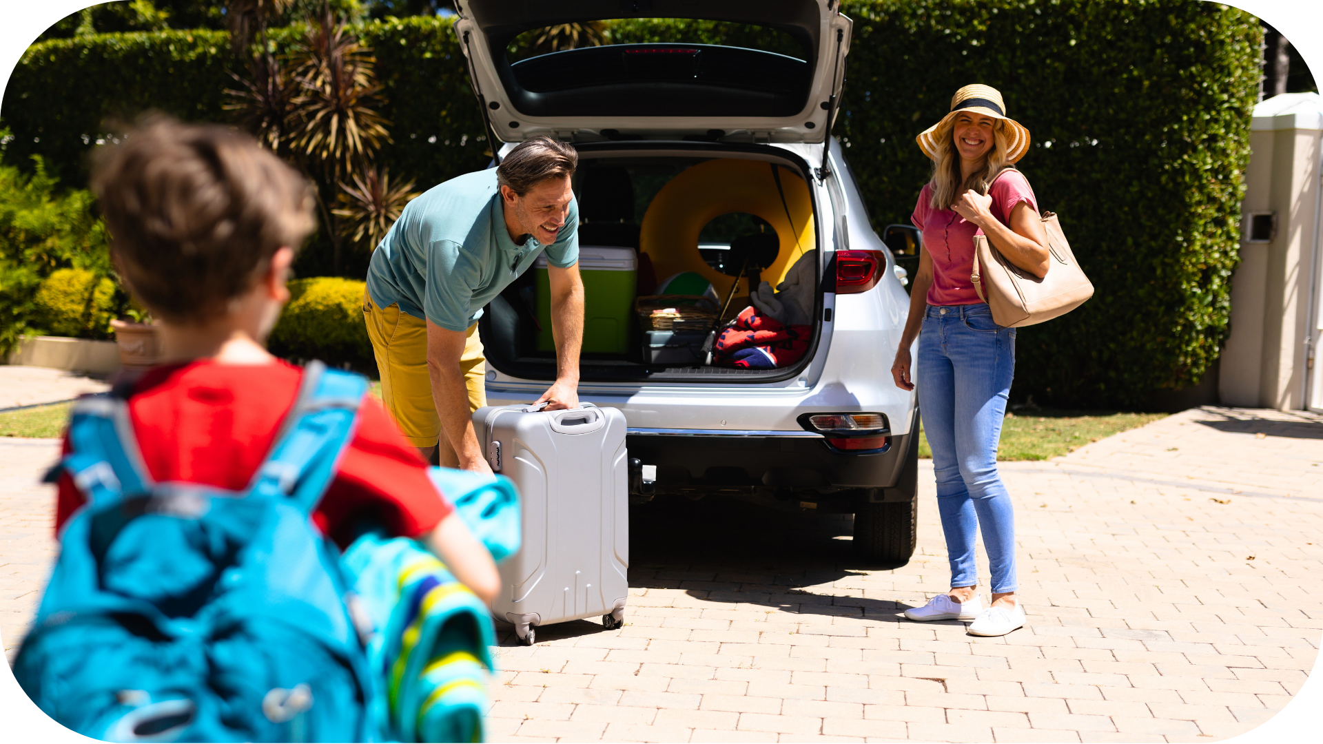 A family packing their car for a vacation