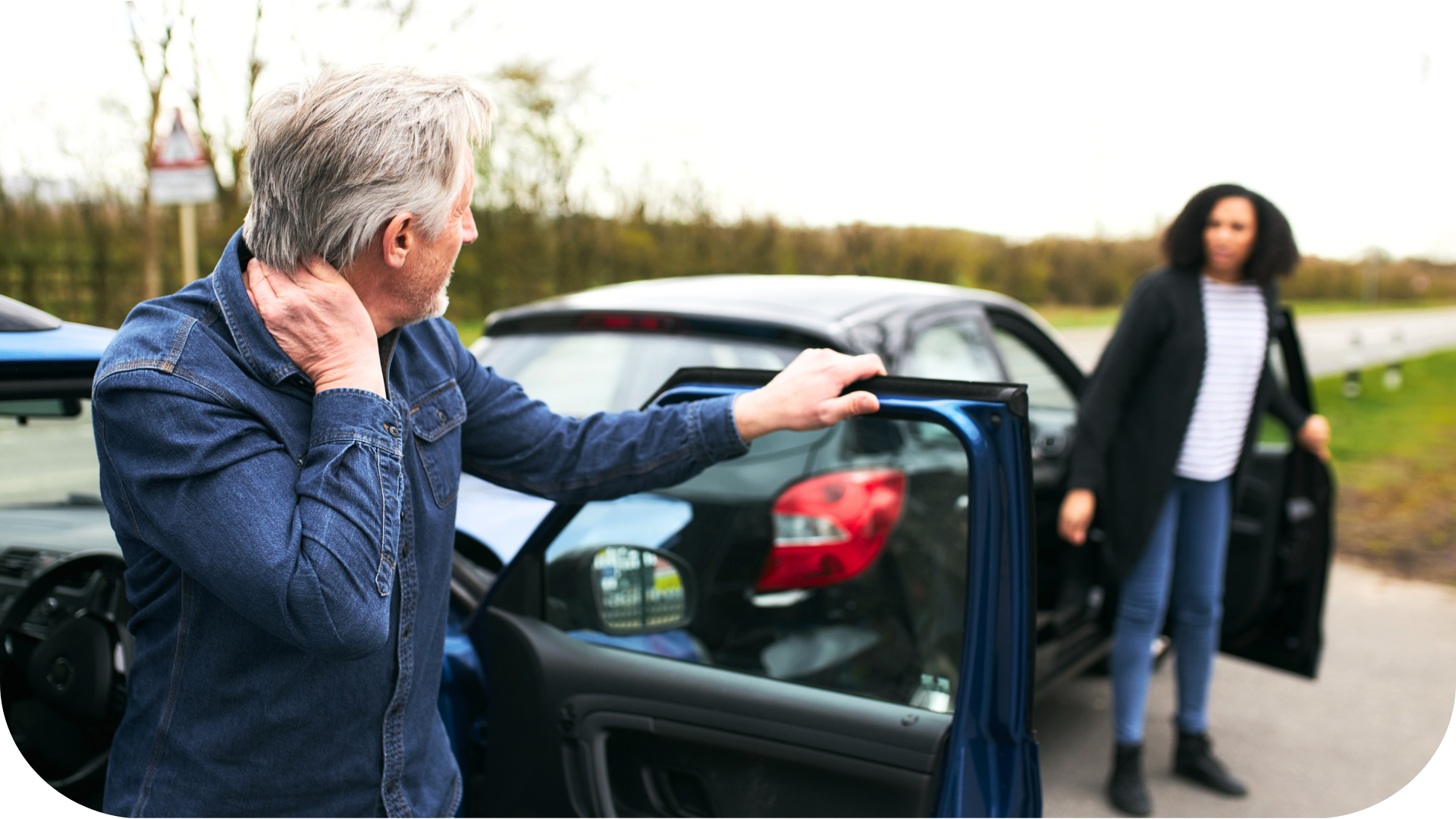 A man and woman in a fender bender