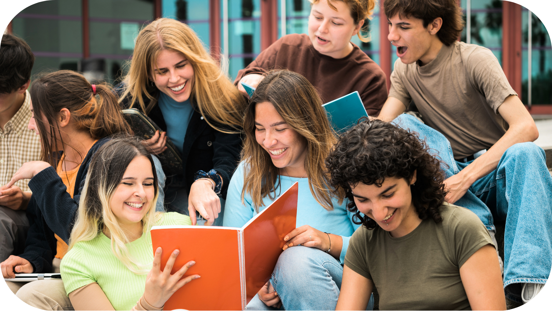 Group of students gathered around a yearbook